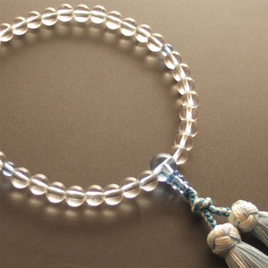 Rosario de un solo aro para mujer elaborado en cristal auténtico y cristal azul con borla de flor plateada