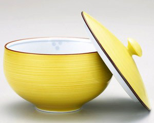 Tetera con tapa en forma de flor y hierba esmaltada en amarillo